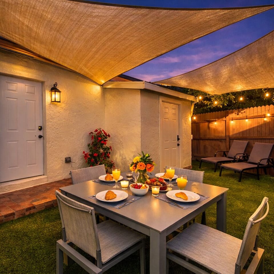 An intimate backyard dinner under soft sunset skies — warm, cozy, and effortlessly inviting. ✨🍽️