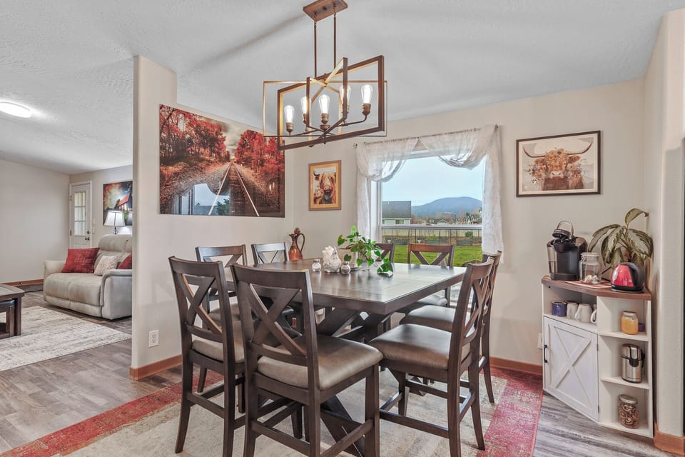 The dining area is a charming and inviting space, perfect for family meals and entertaining guests.
