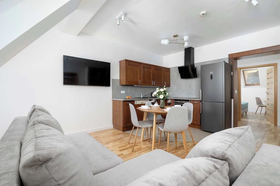 Comfortable living room with sofa and TV.
