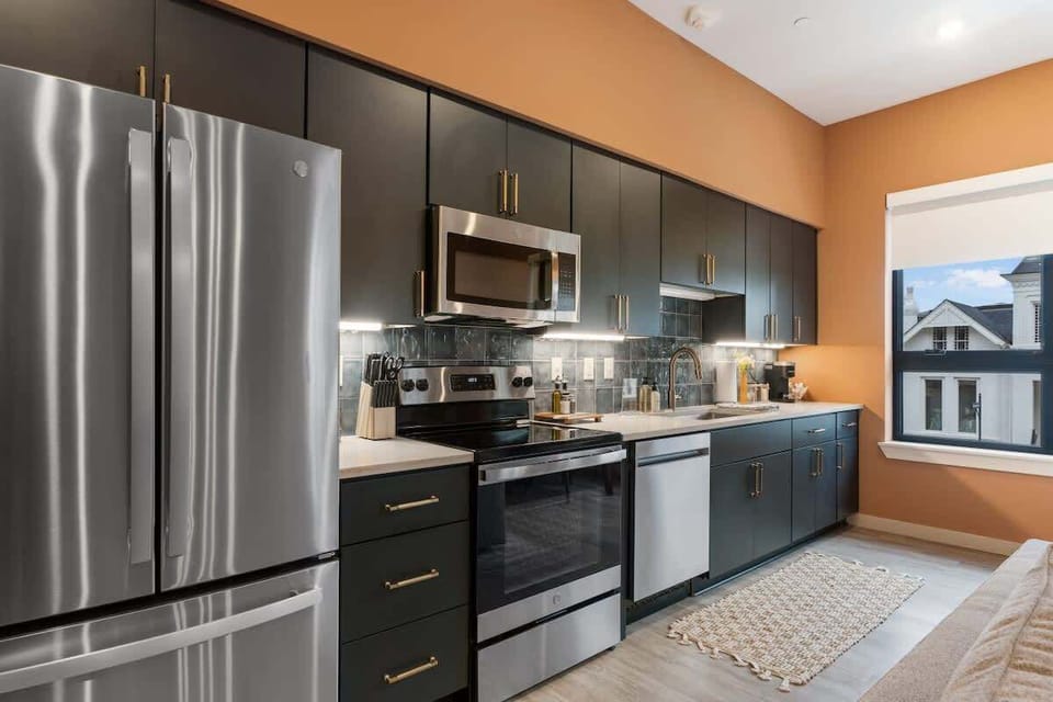Open kitchen with all essential appliances, coffee station and condiments 