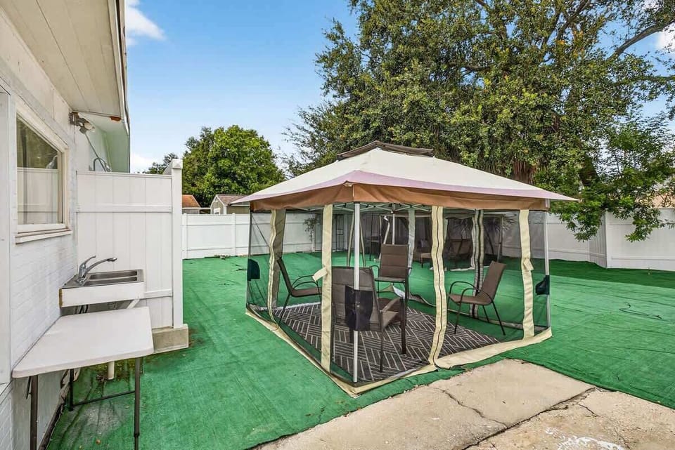 A peaceful gazebo nestled in the backyard, ideal for morning coffee or evening chats.