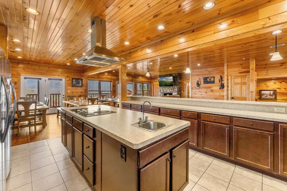 Gourmet kitchen featuring dual refrigerators and professional stainless appliances.