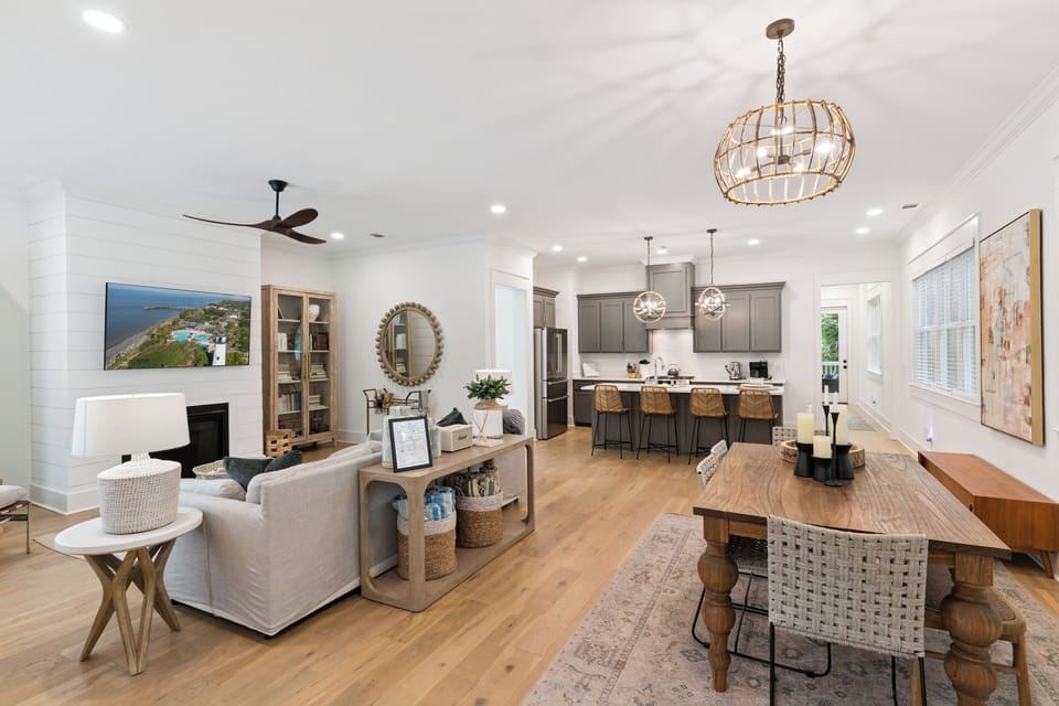 Gather around your spacious dining table or sink into the plush sofa while natural light fills this beautifully appointed open living space.