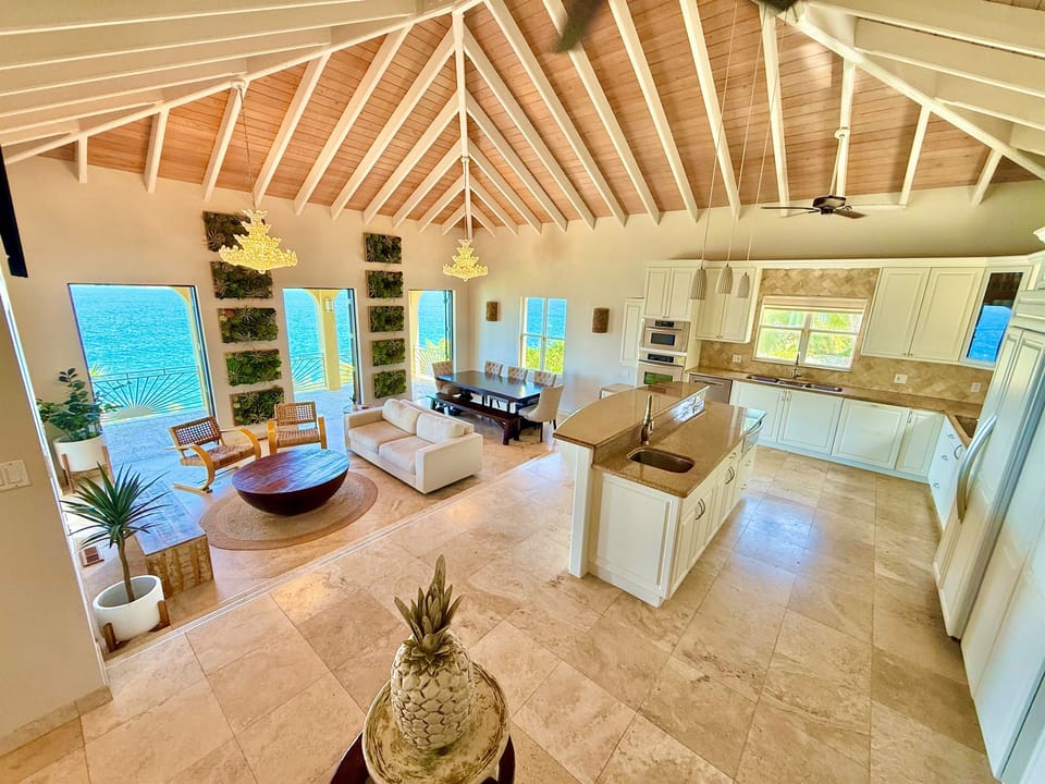 Bright, airy living space designed for gathering—dine, lounge, and enjoy the sea breeze with views.
