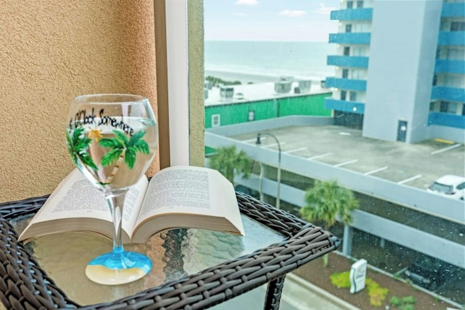 A glass of wine, a good book and an ocean view!