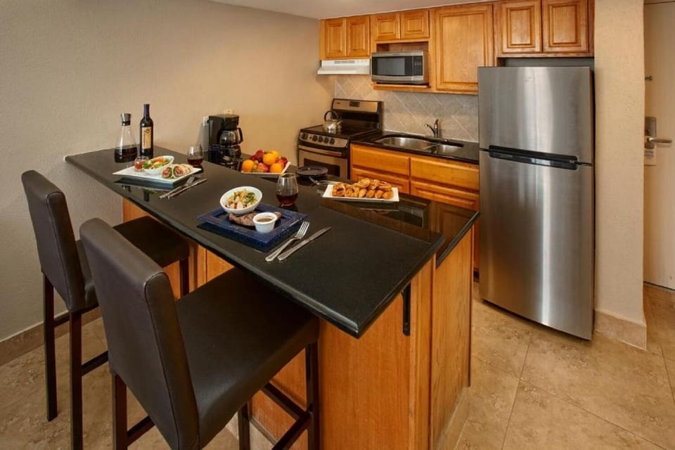 Savor easy meals with a full kitchenette and casual bar seating.