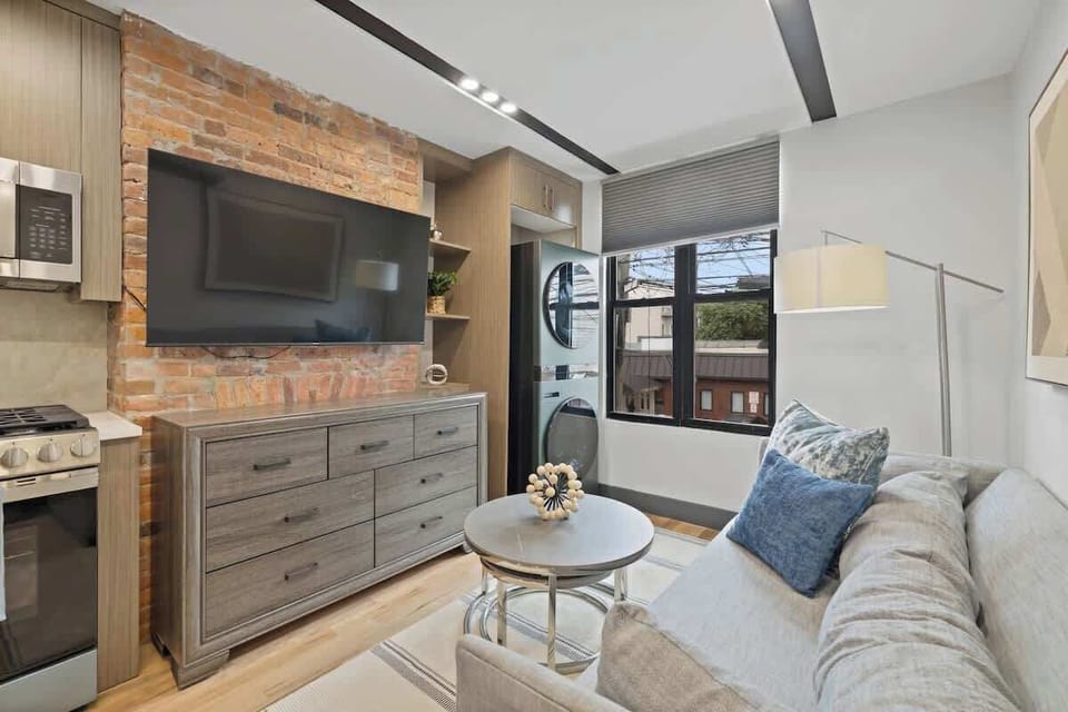 Large windows bring in natural light, creating a bright atmosphere.