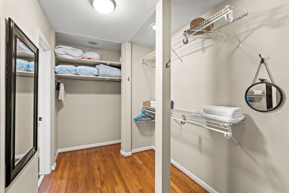 Spacious walk-in closet off the primary bedroom, leads directly into primary bathroom