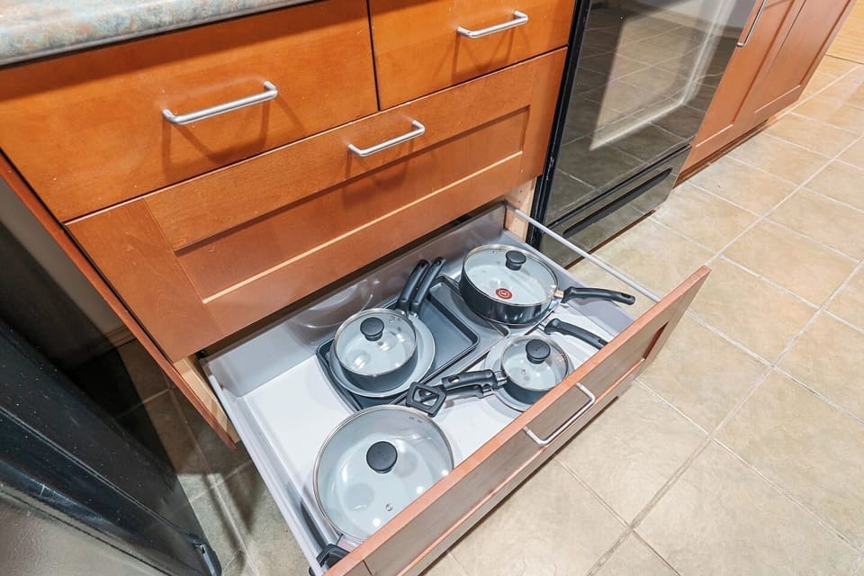 All the essentials provided: pots, pans, dishes, silverware, wine glasses, and cooking basics.