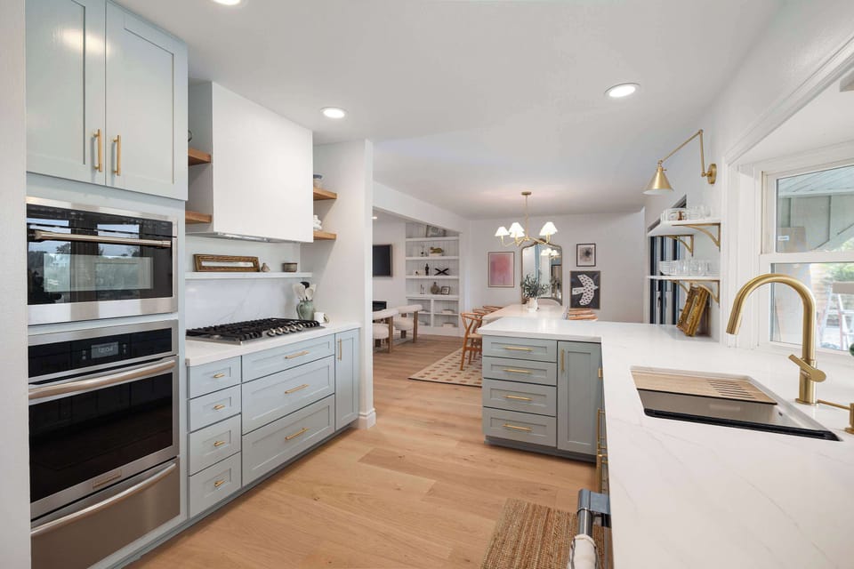 Cook and gather in this bright, modern kitchen featuring sleek finishes and plenty of counter space. Fully equipped for everything from quick breakfasts to group meals.