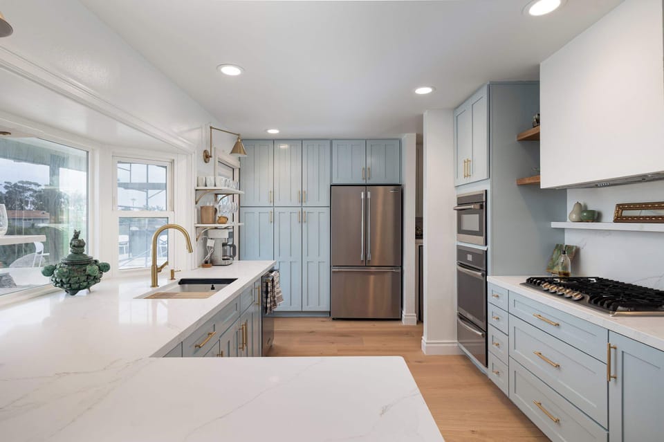 This bright, spacious kitchen features modern appliances, ample counter space, and a clean, airy design. Perfect for cooking, gathering, and everyday convenience.