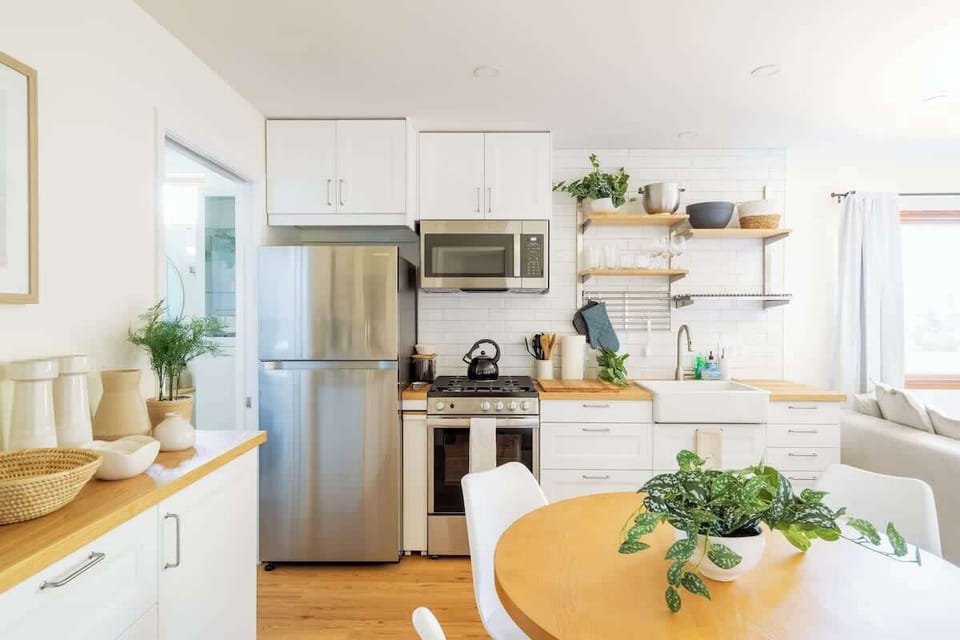 The compact kitchen comes stocked with everything you could need