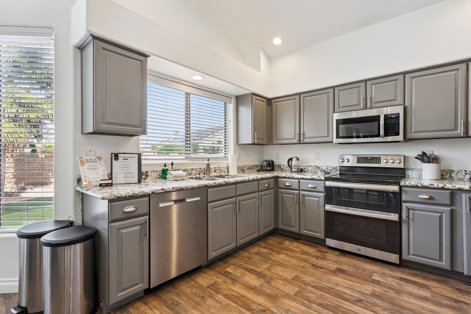 Cook your favorite meals in this fully equipped kitchen with granite countertops, stainless steel appliances, and plenty of cabinet space for all your culinary adventures.