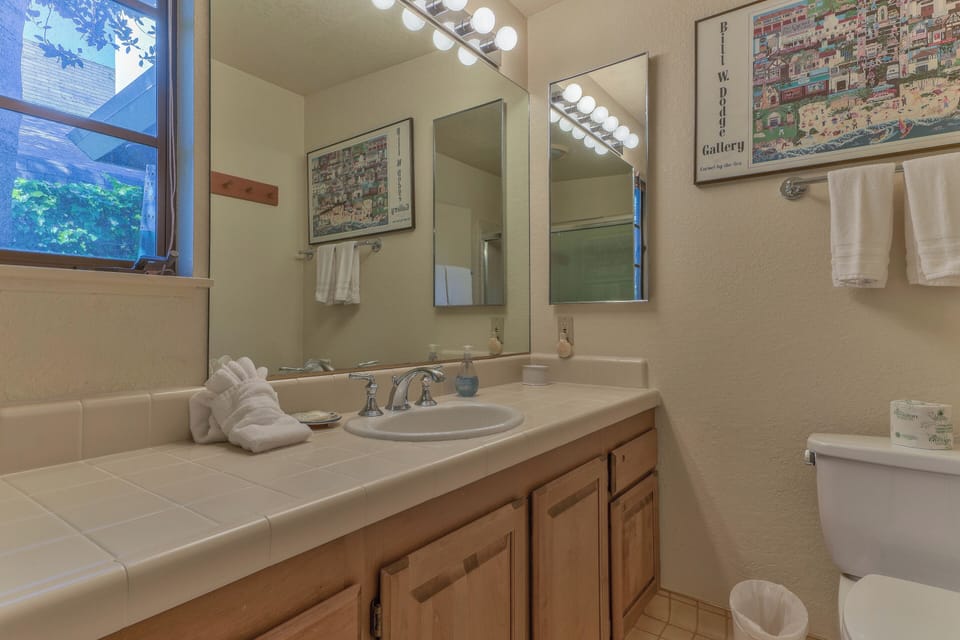 Bathroom #2, En Suite to Bedroom #2 with Shower/Tub Combo