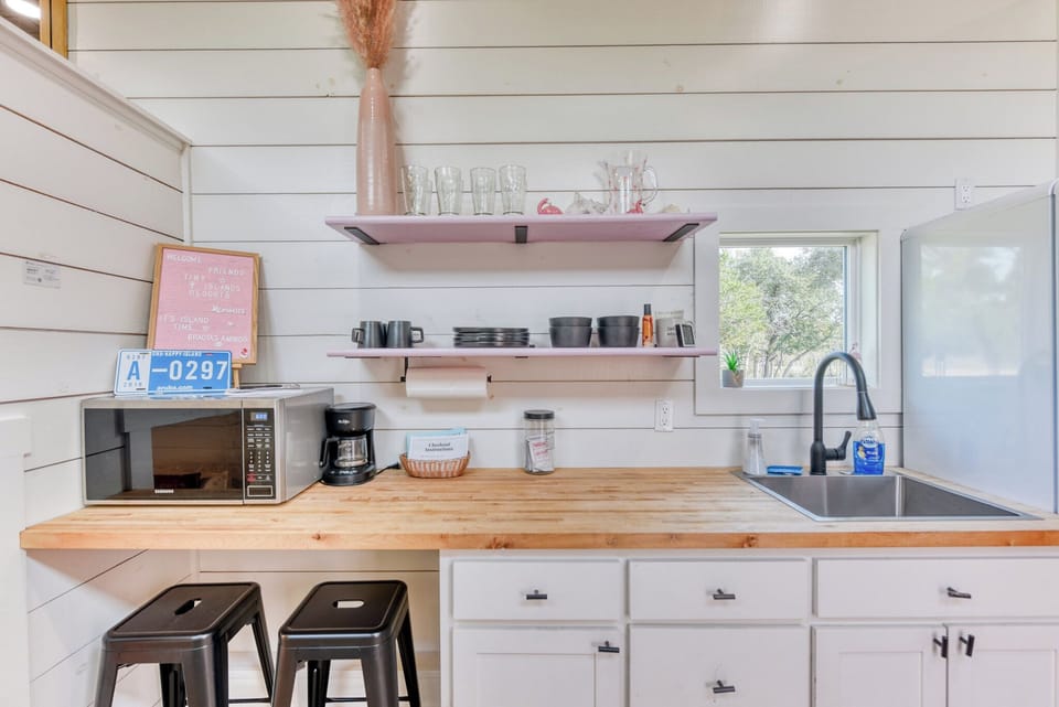 The tiny home has a kitchenette