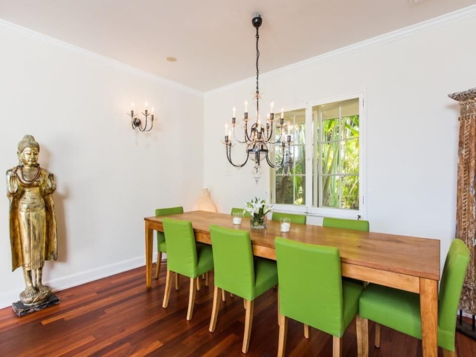 An inviting dining space ideal for shared meals, framed by natural light and refined finishes.