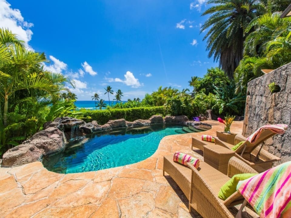 Private resort-style pool set below the main lanai, offering layered privacy and tropical surroundings.