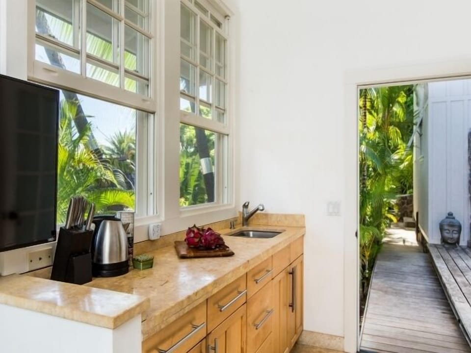 Convenient kitchenette for light meals and morning coffee within the private bungalow.
