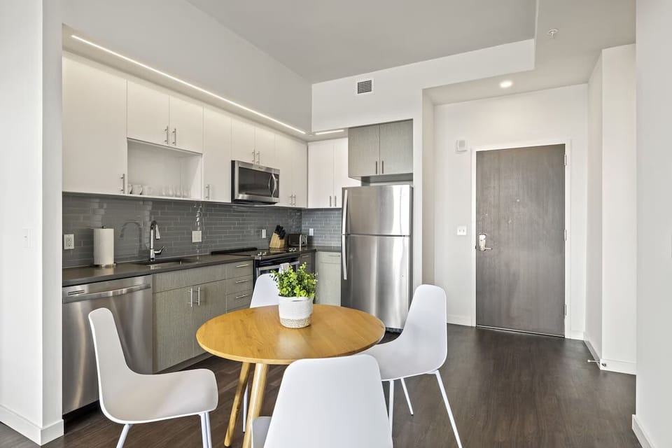 Sip morning coffee in a sleek kitchen with modern appliances.