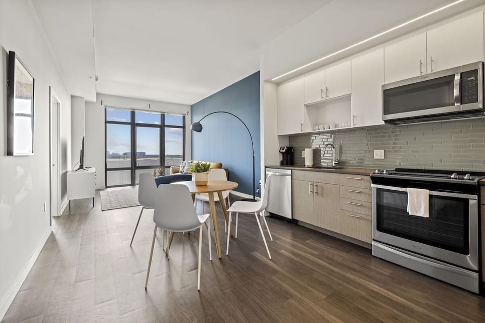 Gather for meals in an airy, modern open kitchen.