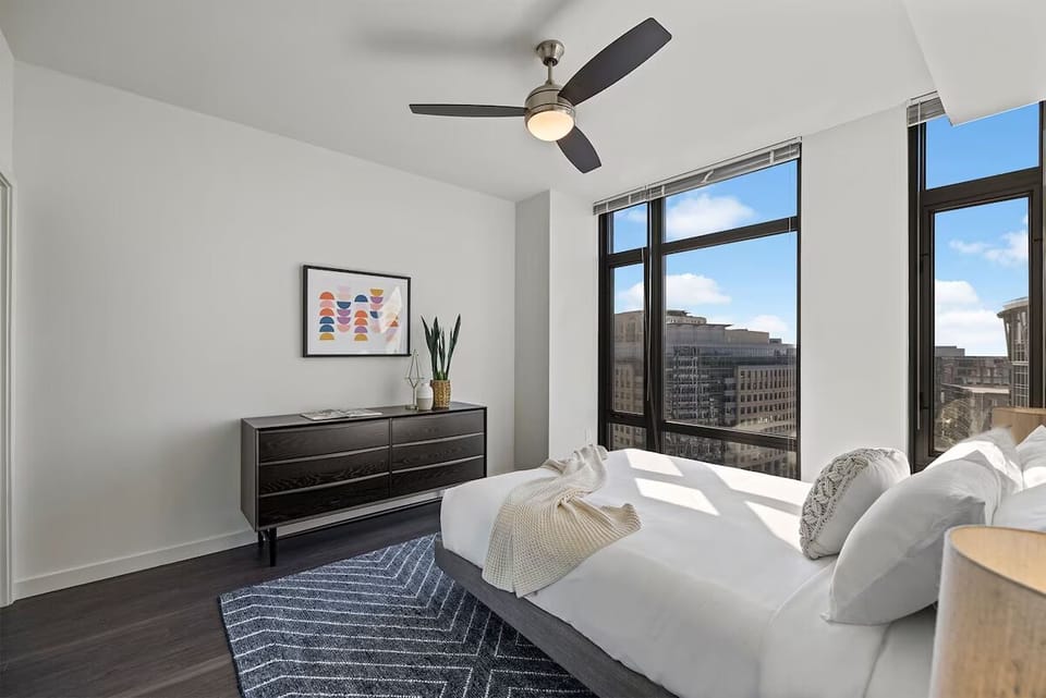 Drift off beneath high windows with stunning city vistas.
