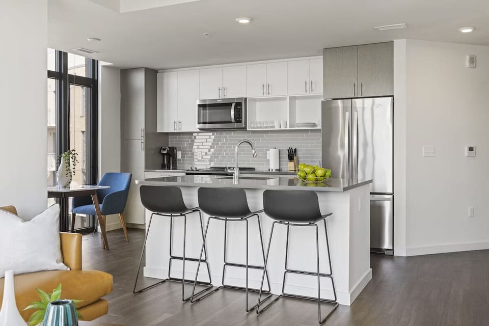 Cook with ease in a sleek kitchen with bar seating.