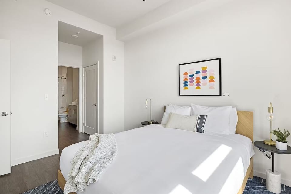 Recharge in serene, hotel-style comfort with soft neutral tones.