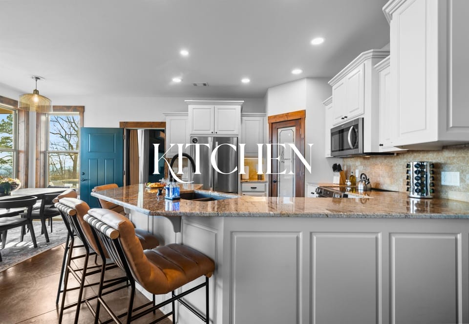 The kitchen island offers plenty of room for morning coffee chats or evening appetizers while meals come together with ease.