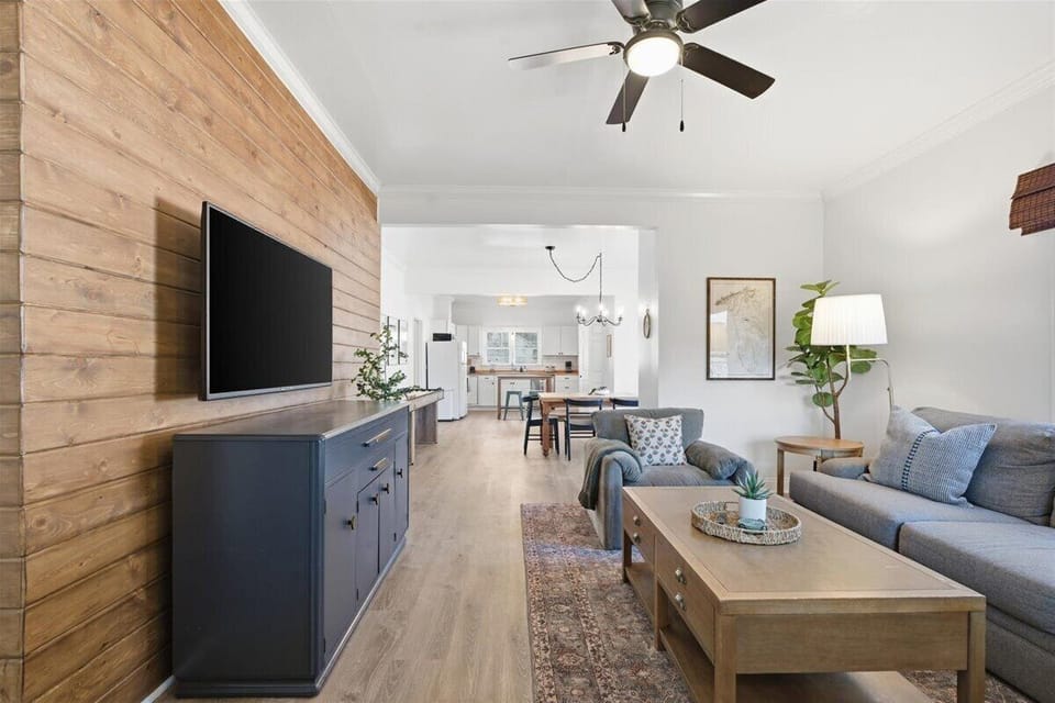 Bright open living room flowing into the kitchen—perfect for relaxing