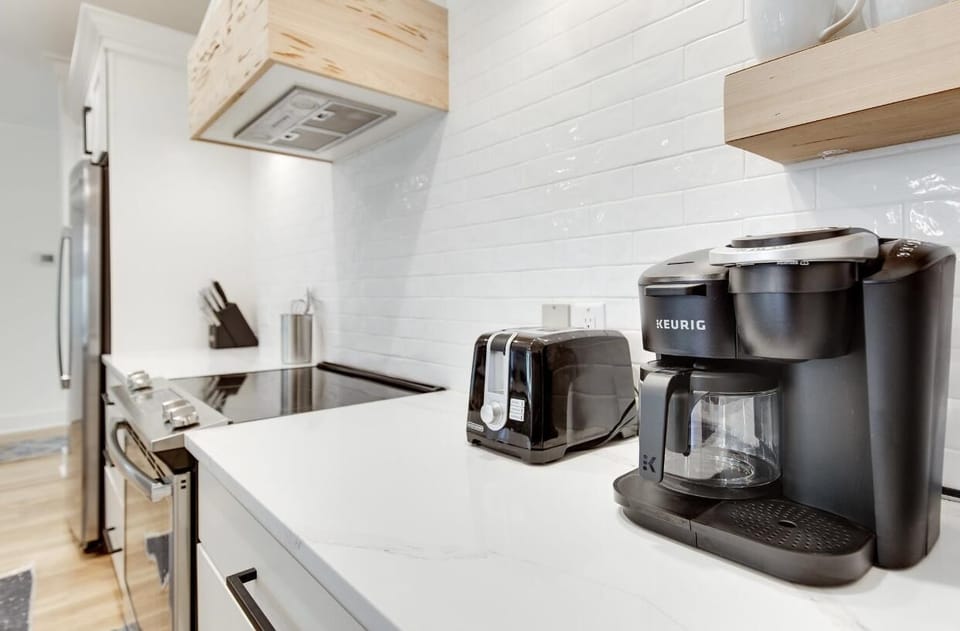 Modern kitchen with sleek appliances and bright countertops