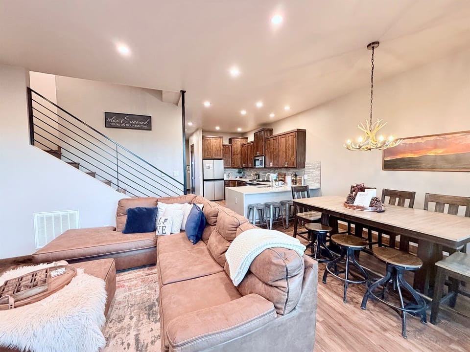 1) Open-concept living area with seamless flow to dining and kitchen