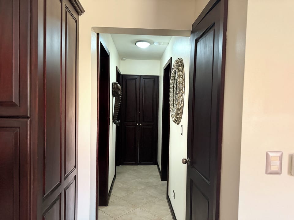 Hallway leading to bedrooms and bathroom