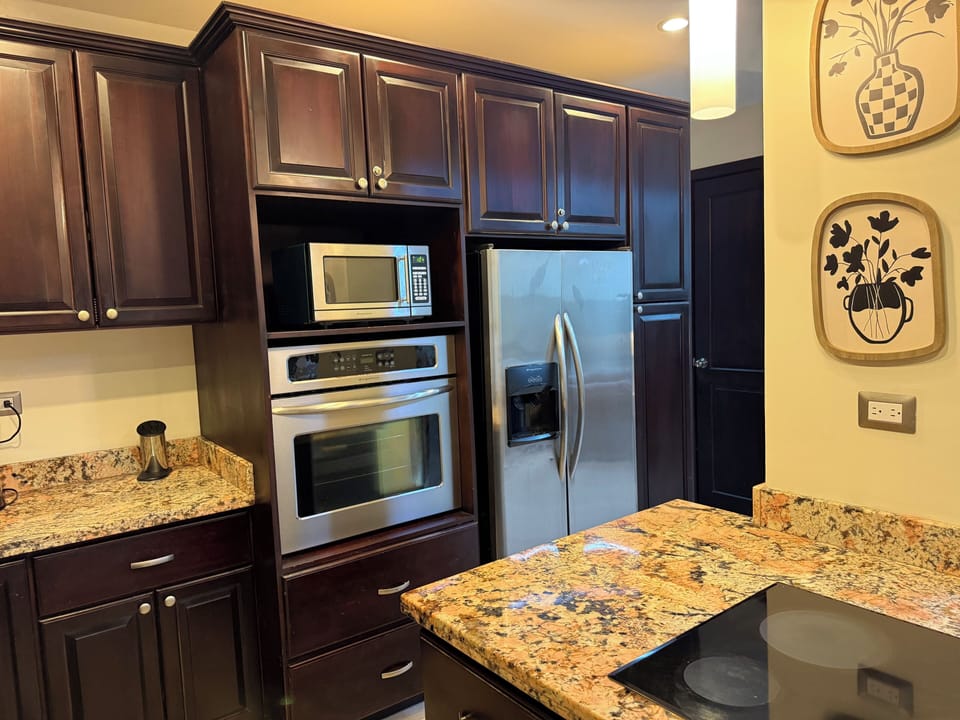 Fully equipped kitchen with granite countertops and stainless appliances