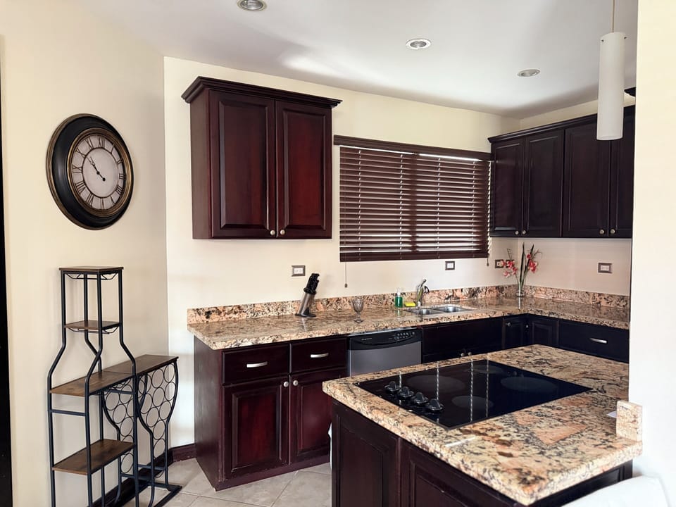 Modern kitchen with stainless appliances and ample storage