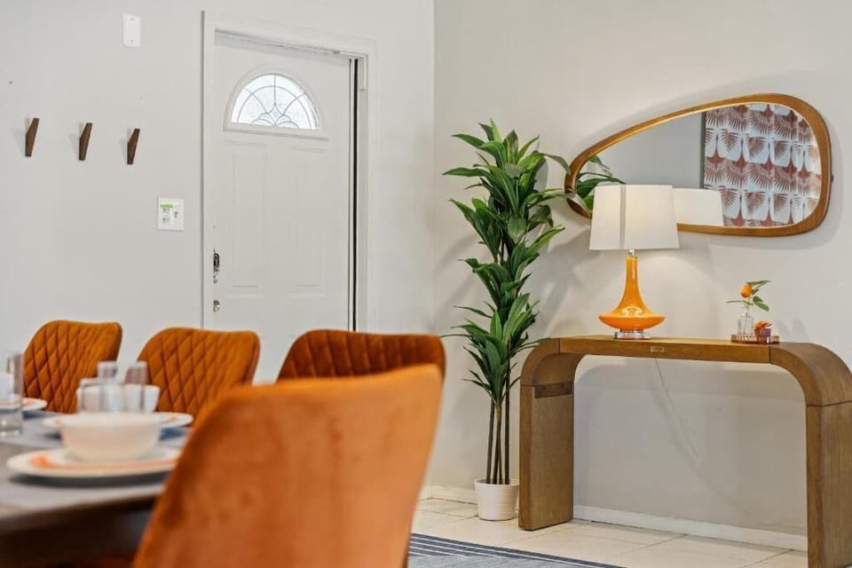 Welcoming entryway with stylish console and coastal accents