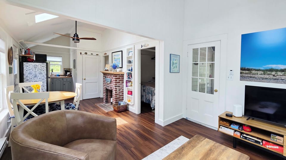 Living room with comfortable seating and large flat screen TV