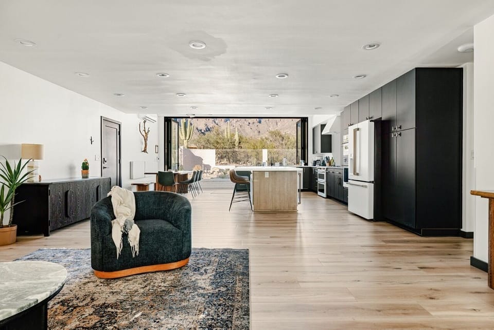 Expansive living and kitchen area is open, airy, yet cozy