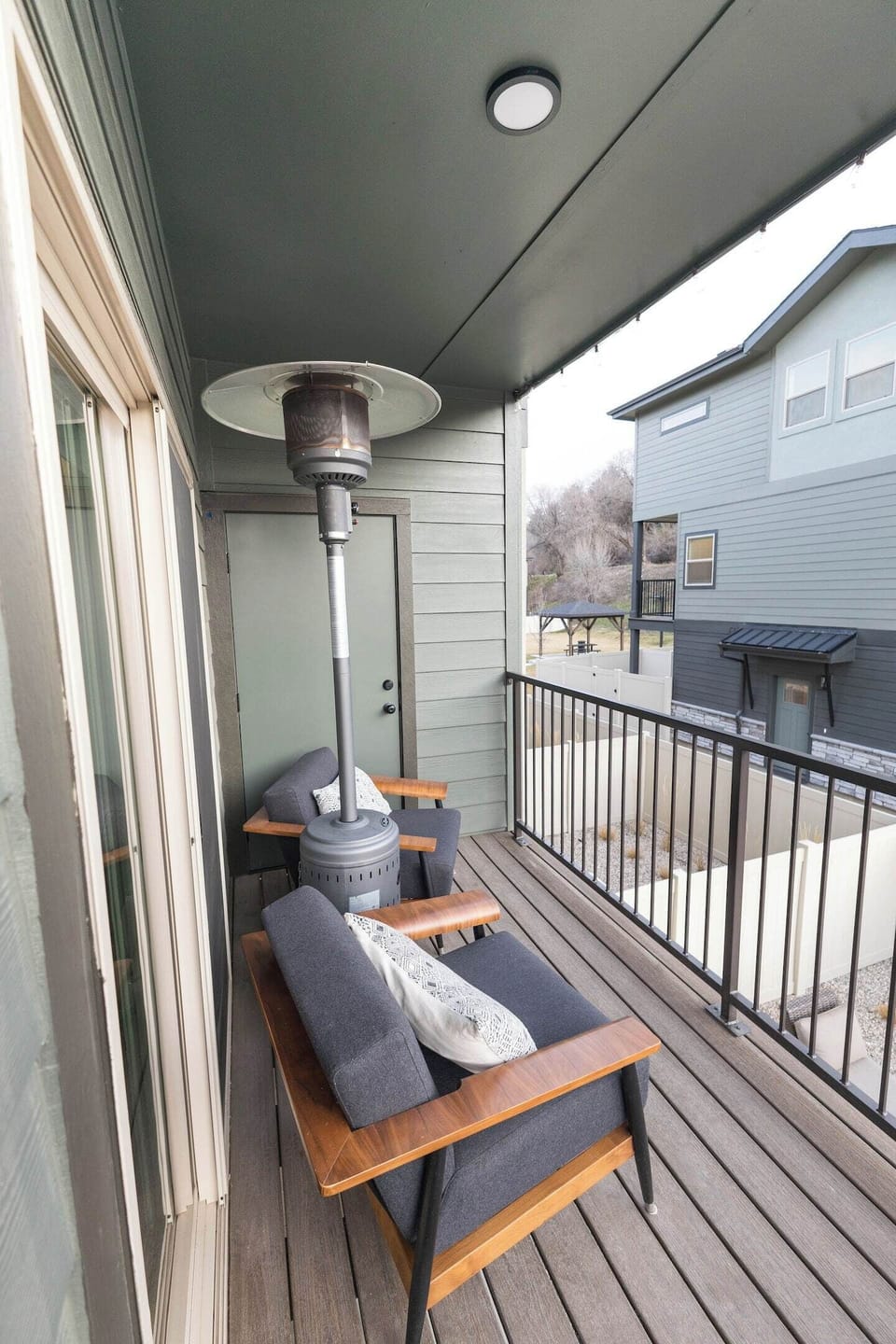 2 outdoor chairs and a heater.