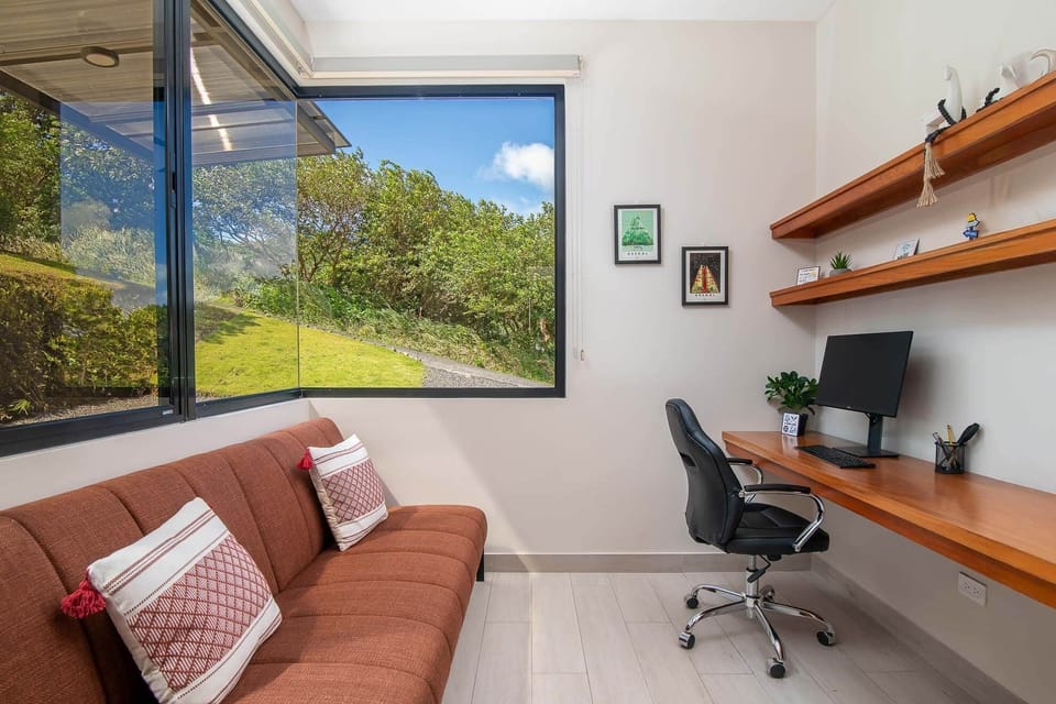 Office with workstation for two and sofa bed