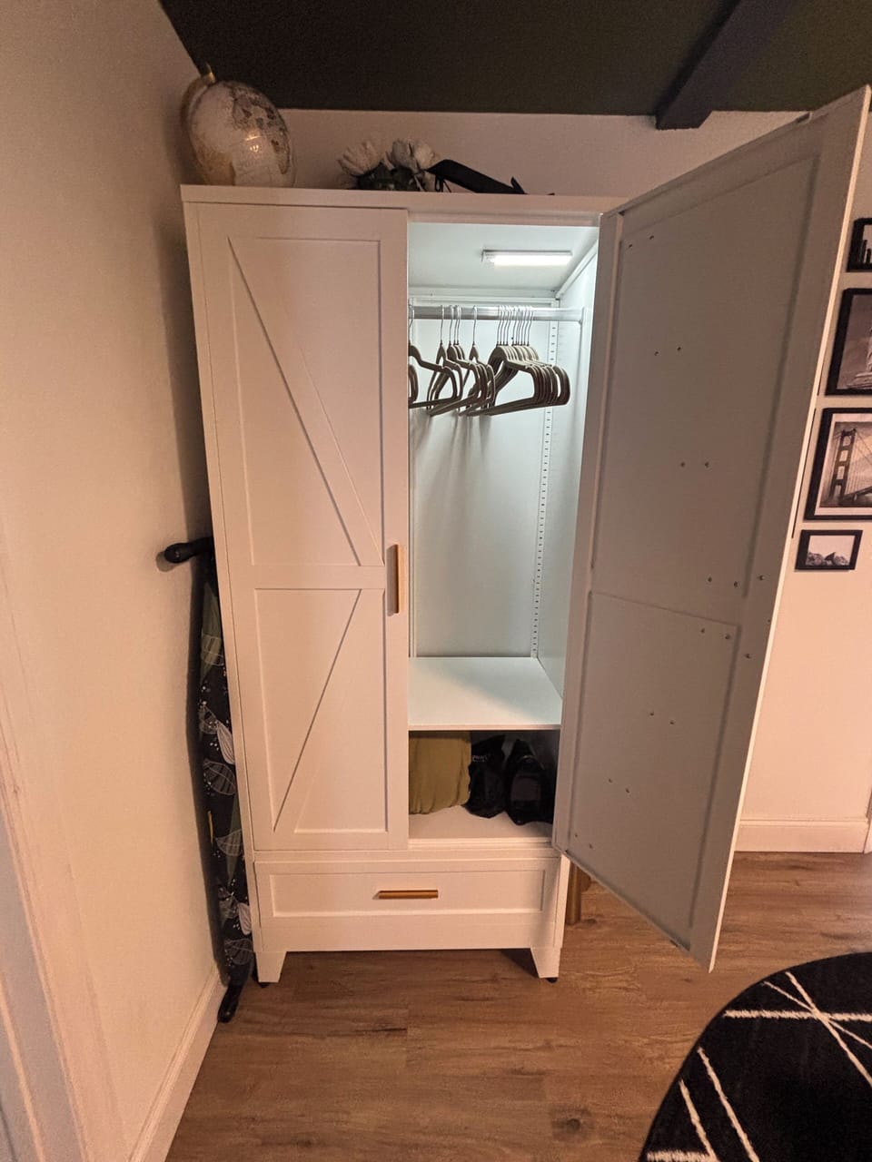 Closet storage including iron, iron board, steamer, hangers, extra sheets, etc