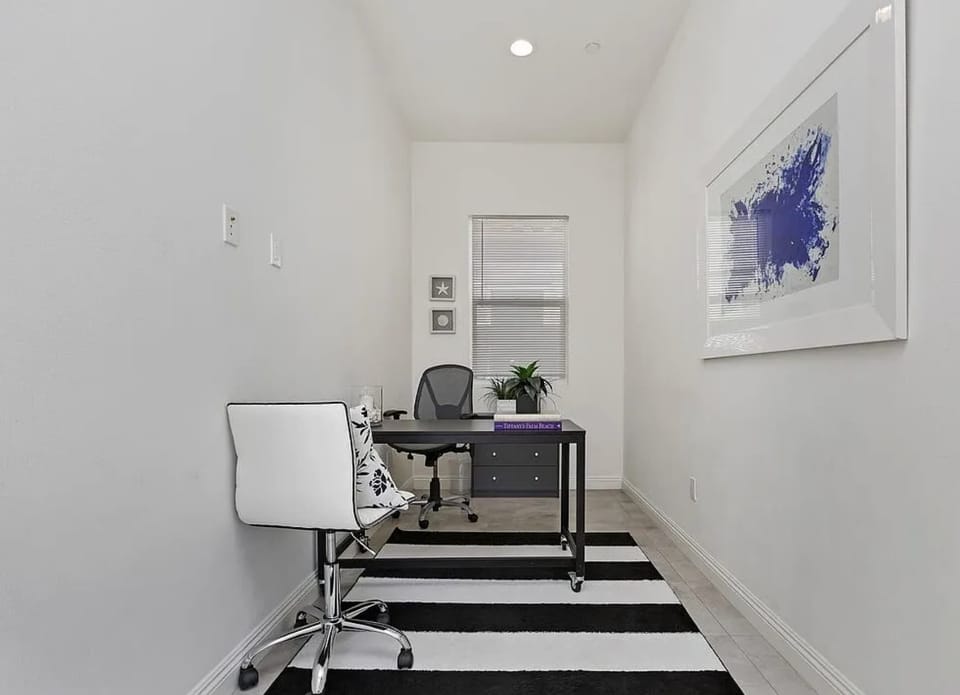 Dedicated workspace with natural light next to the bedroom