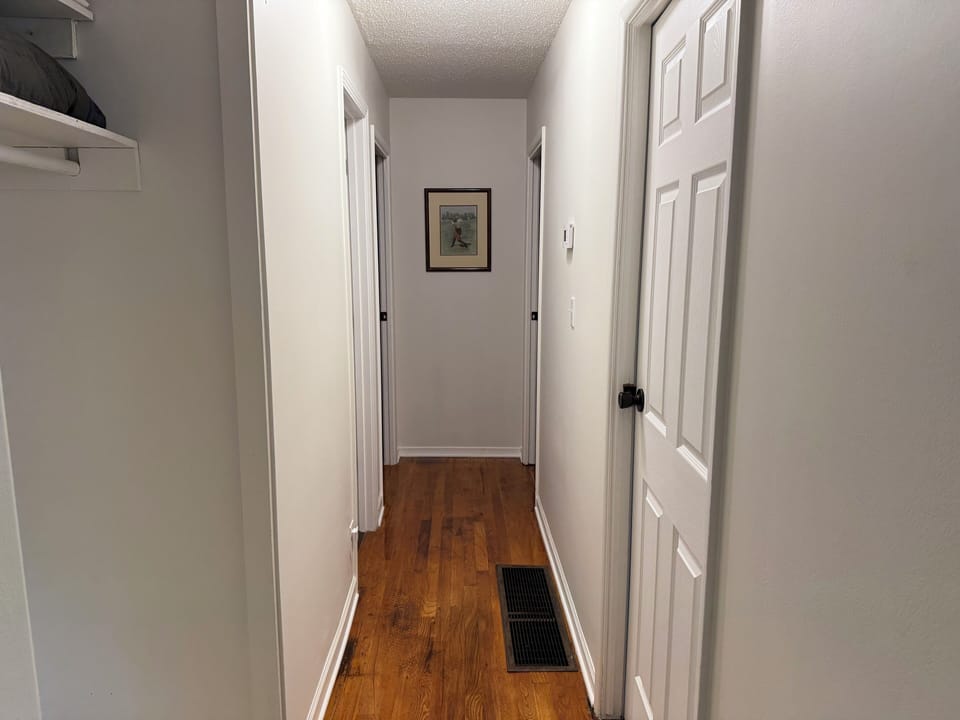 Hallway to bedrooms and bath