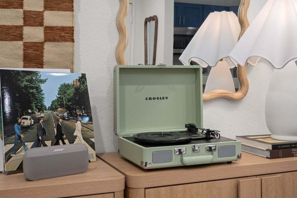 Each of our homes features a record player and JBL speaker.