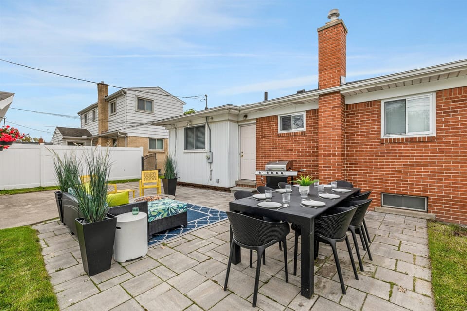 Spacious patio with dining for 6, lounge + BBQ—perfect hangout.