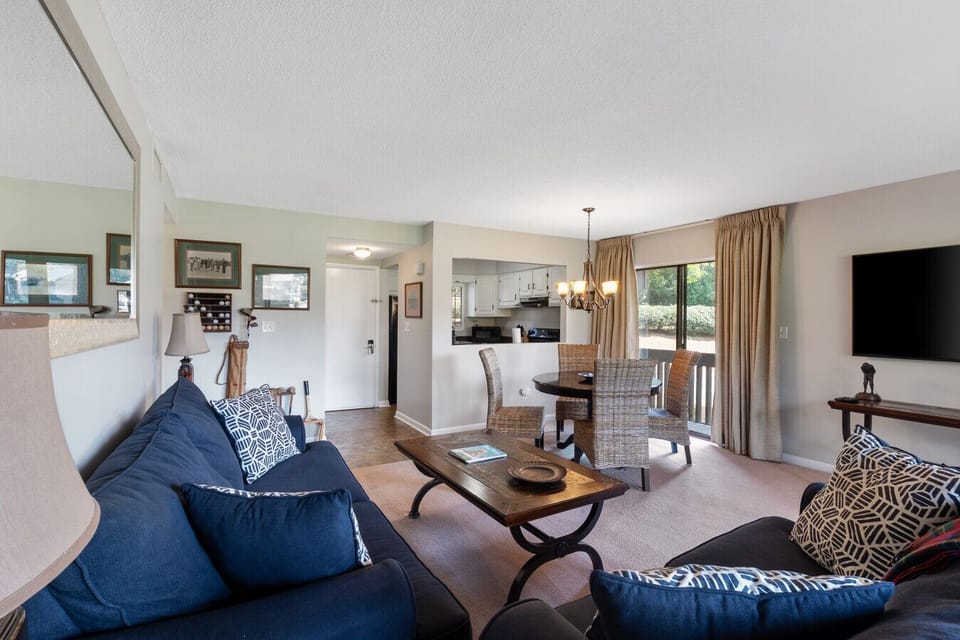 Bright open-concept living space with kitchen, dining, and lounge area all in view.
