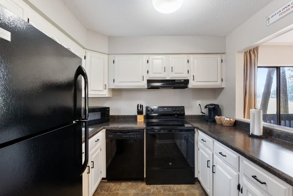 Fully equipped kitchen with modern appliances and plenty of counter space.
