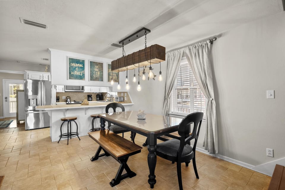 Bright, open kitchen and dining area with rustic charm