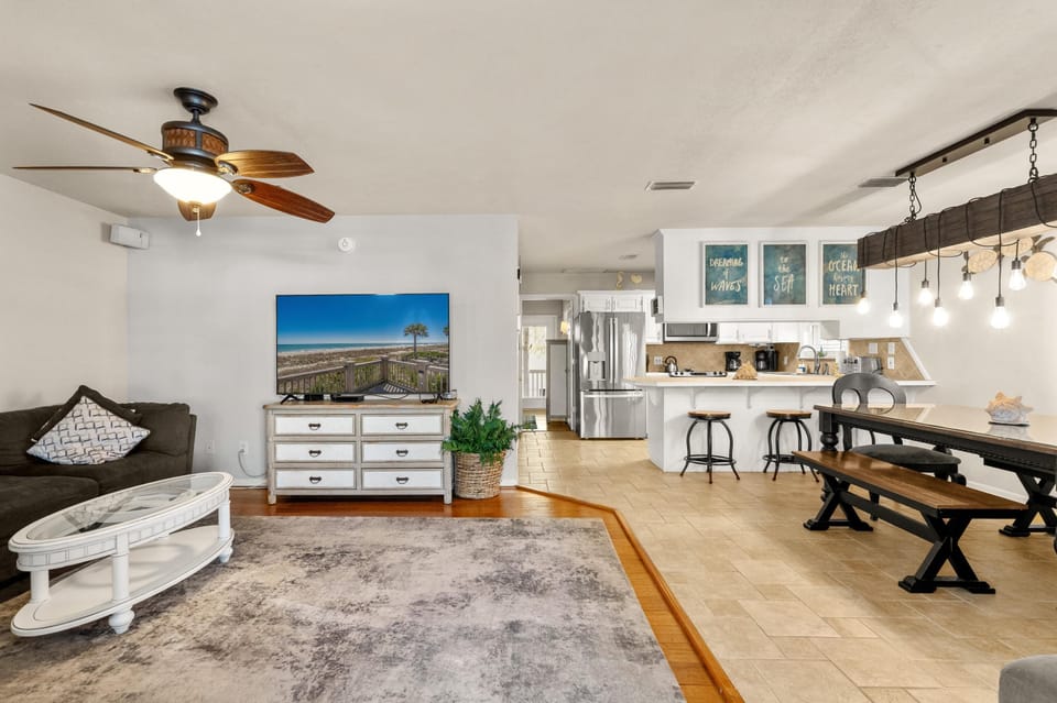 Spacious open living and dining area with modern farmhouse charm