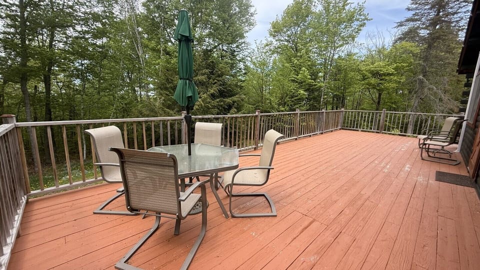 Back porch balcony seating for relaxing and enjoying the outside.