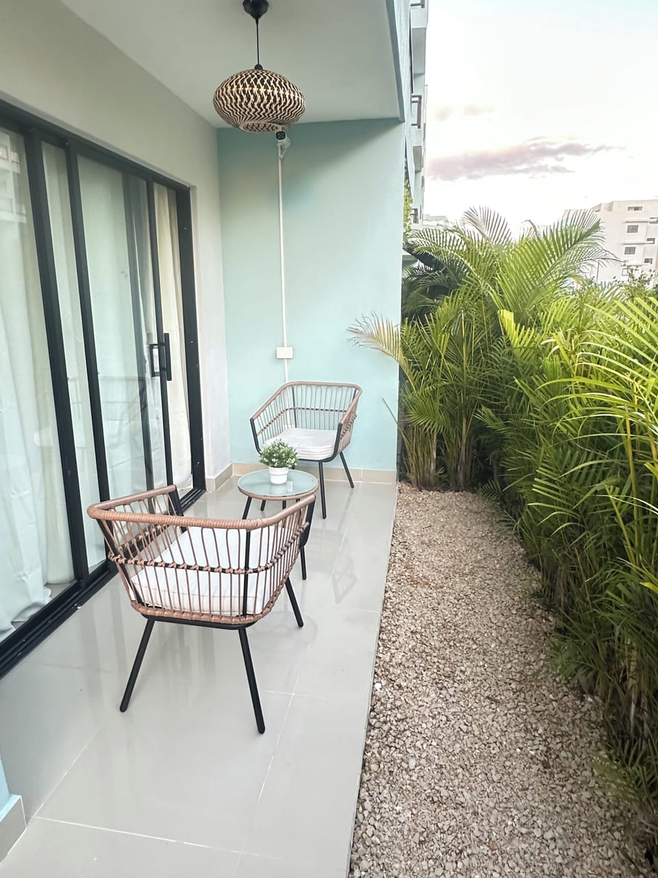 Balcony steps away from swimming pool.